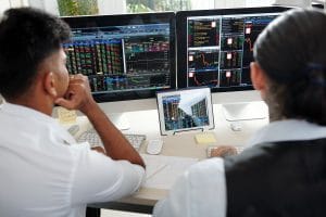 traders analyzing recent stock exchange trends