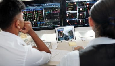 traders analyzing recent stock exchange trends